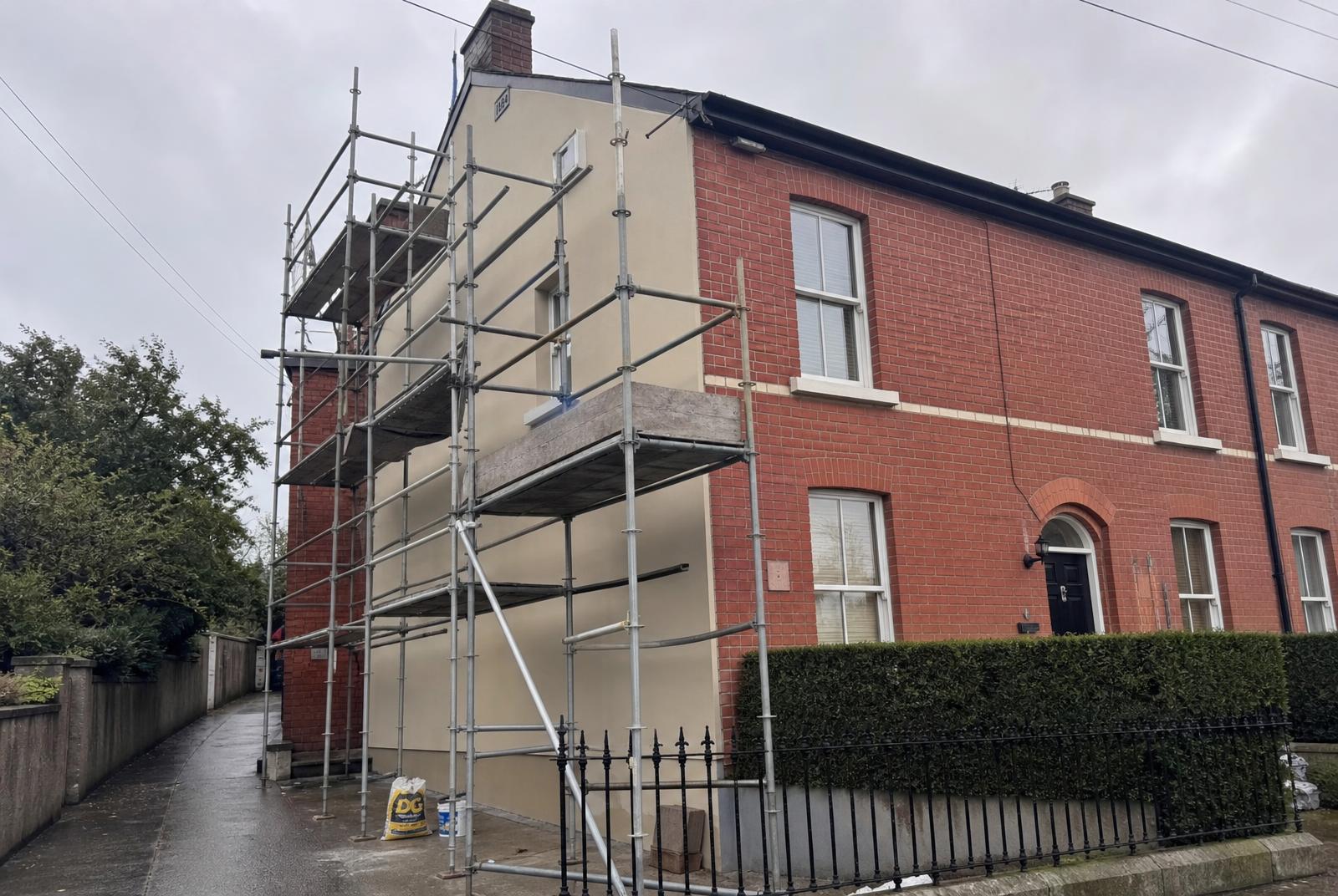 Dublin end-of-terrace house under renovation with scaffolding