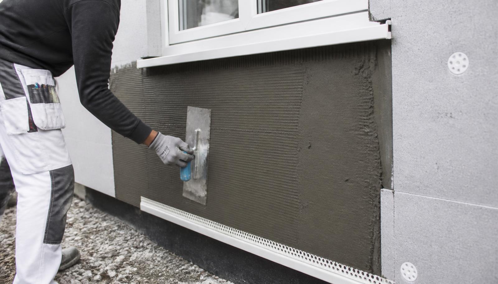 External wall insulation boards and base coat render being installed on an Irish house